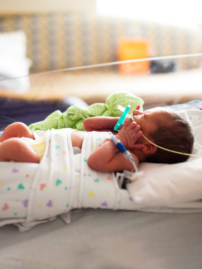 baby in crib in NICU